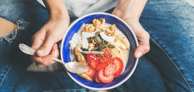 Yogurt, granola, seeds, fresh, dry fruits and honey in bowl